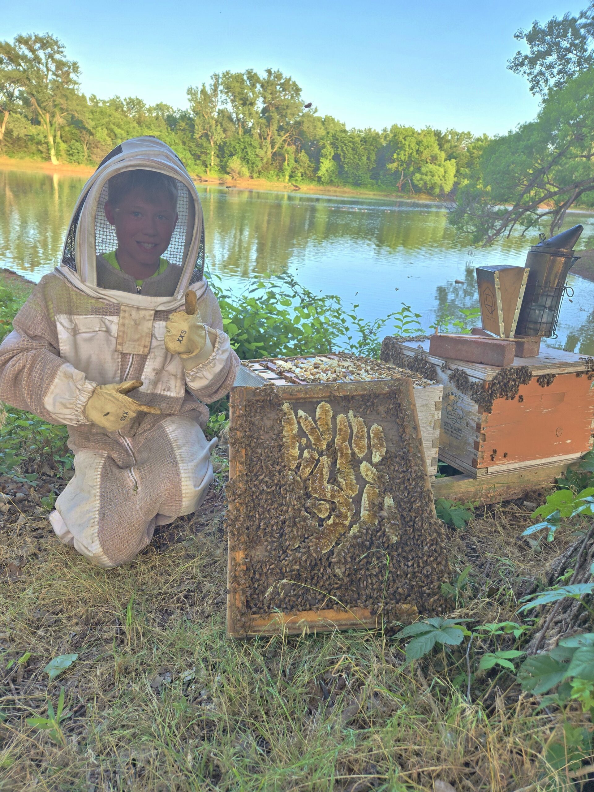 Lucas Scott works the hives. Photo courtesy of Sweet Stingers.