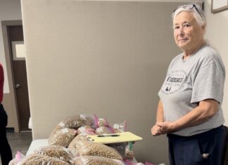 Keeping Pets in Homes, Not Shelters Sarah handles CCPRF’s pet food station at Hungry Hearts Feeding Ministry. Photo by M. Cronk.